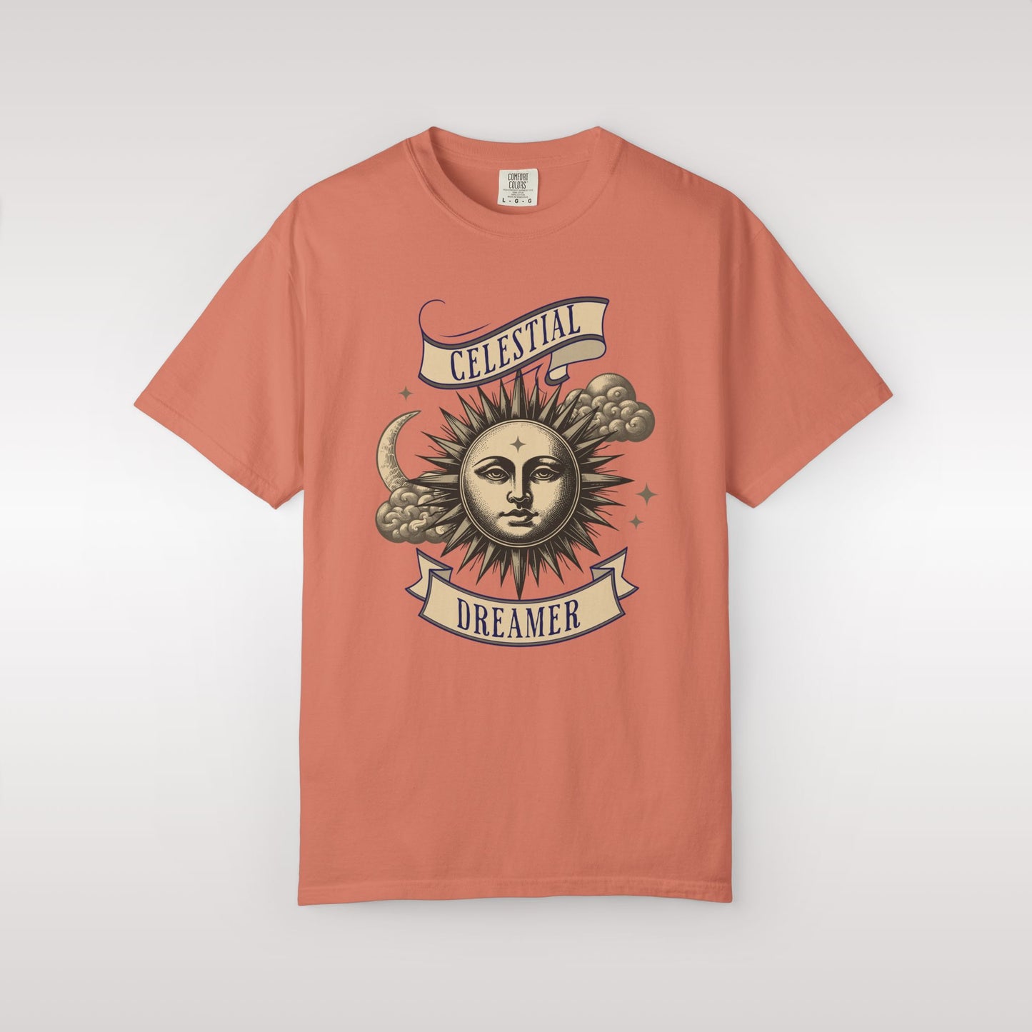 Coral t-shirt with celestial design on a white background
