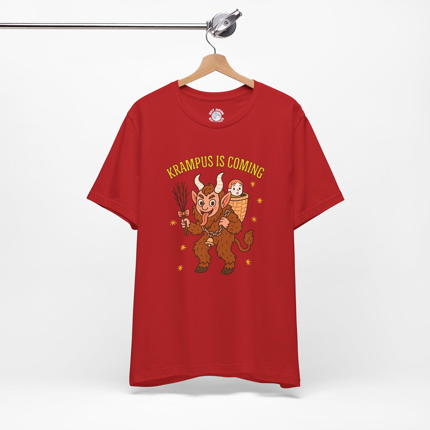 Red t-shirt with Krampus graphic and text 'Krampus is Coming' on a hanger against a white background