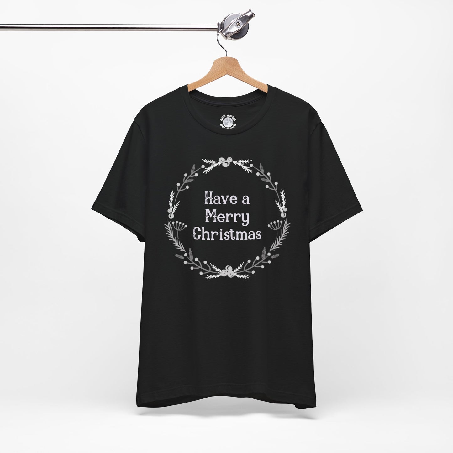 Black t-shirt with 'Have a Merry Christmas' text on a hanger against a white background