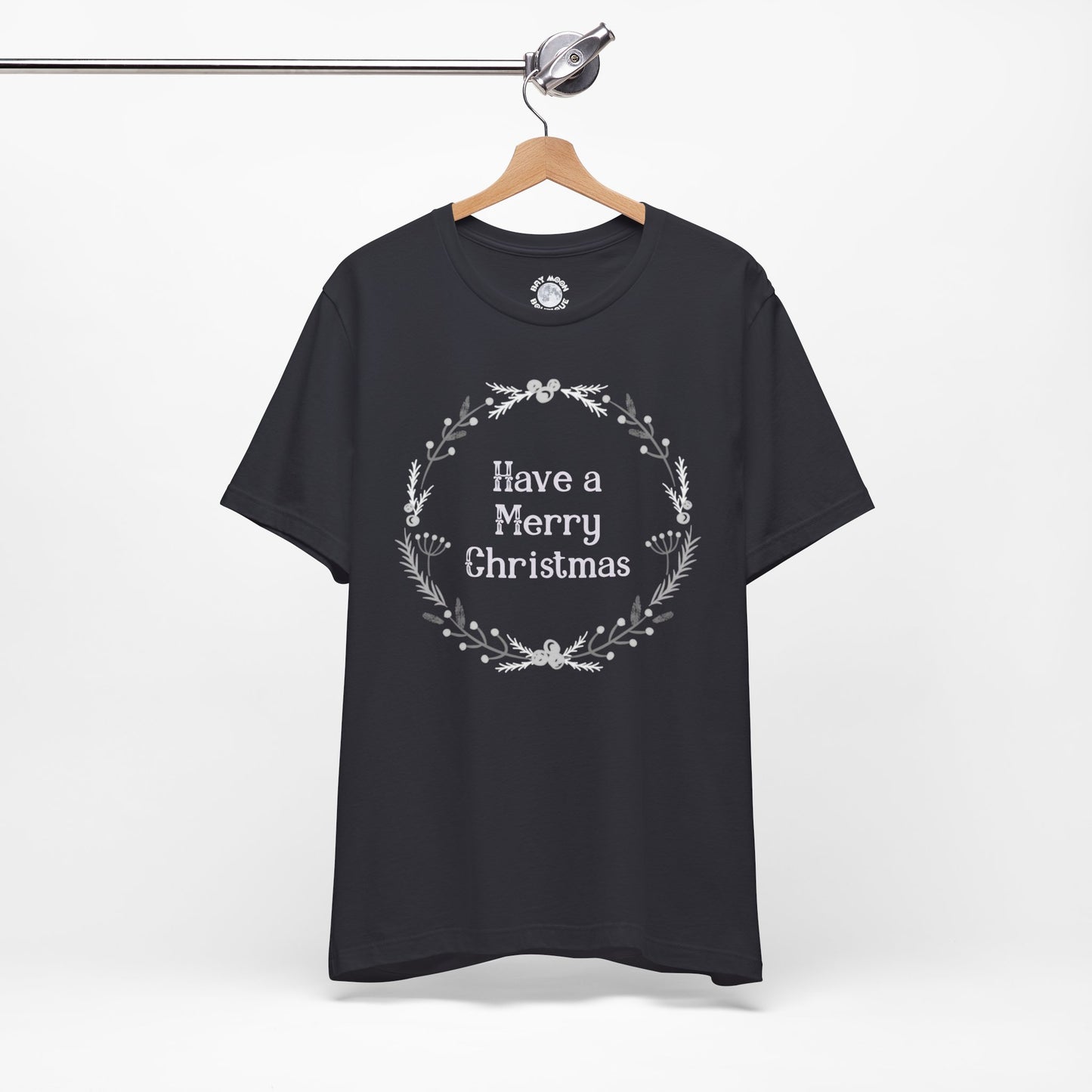 Dark gray t-shirt with 'Have a Merry Christmas' text on a hanger against a white background