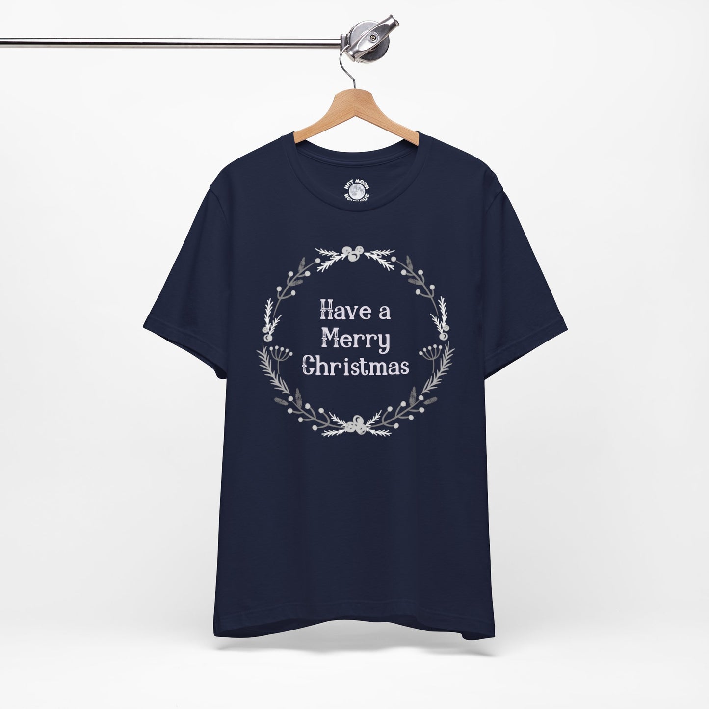 Navy blue t-shirt with 'Have a Merry Christmas' text on a hanger against a white background